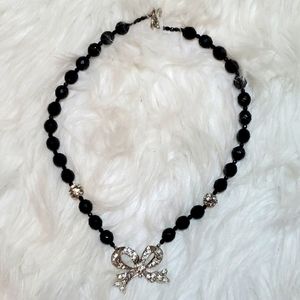 Boutique black, silver tone with a bling bow necklace